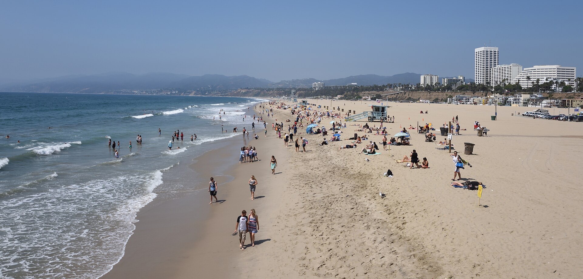 Santa Monica State Beach seen from the pier with swimmers in the water